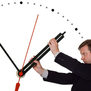 Businessman stop time isolated on white background