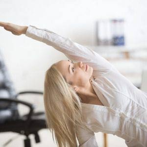 Business woman doing exercises at desk
