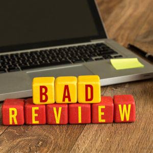 Bad Review written on a wooden
