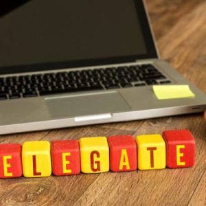 Delegate written on a wooden