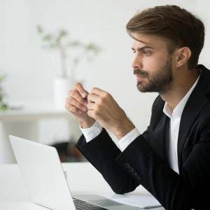 Businessman thinking at work