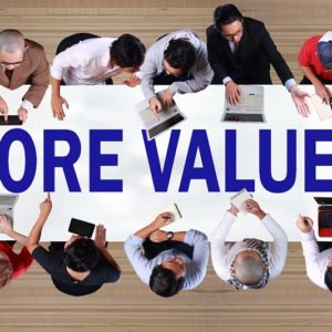 Core Values with employees around a table
