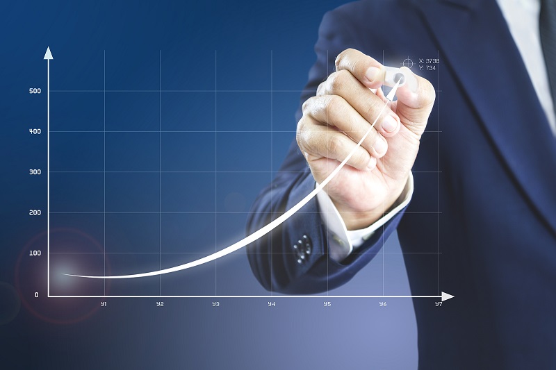 Businessman with increasing graph