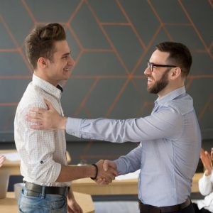 Manager shaking hands with an employee
