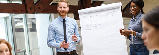 Facilitators running a managers training event