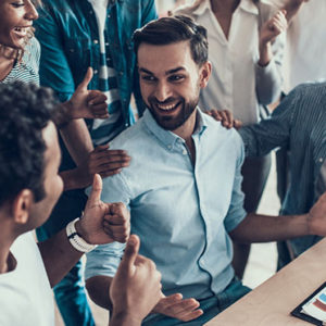 Successful Business Team Congratulating Colleague