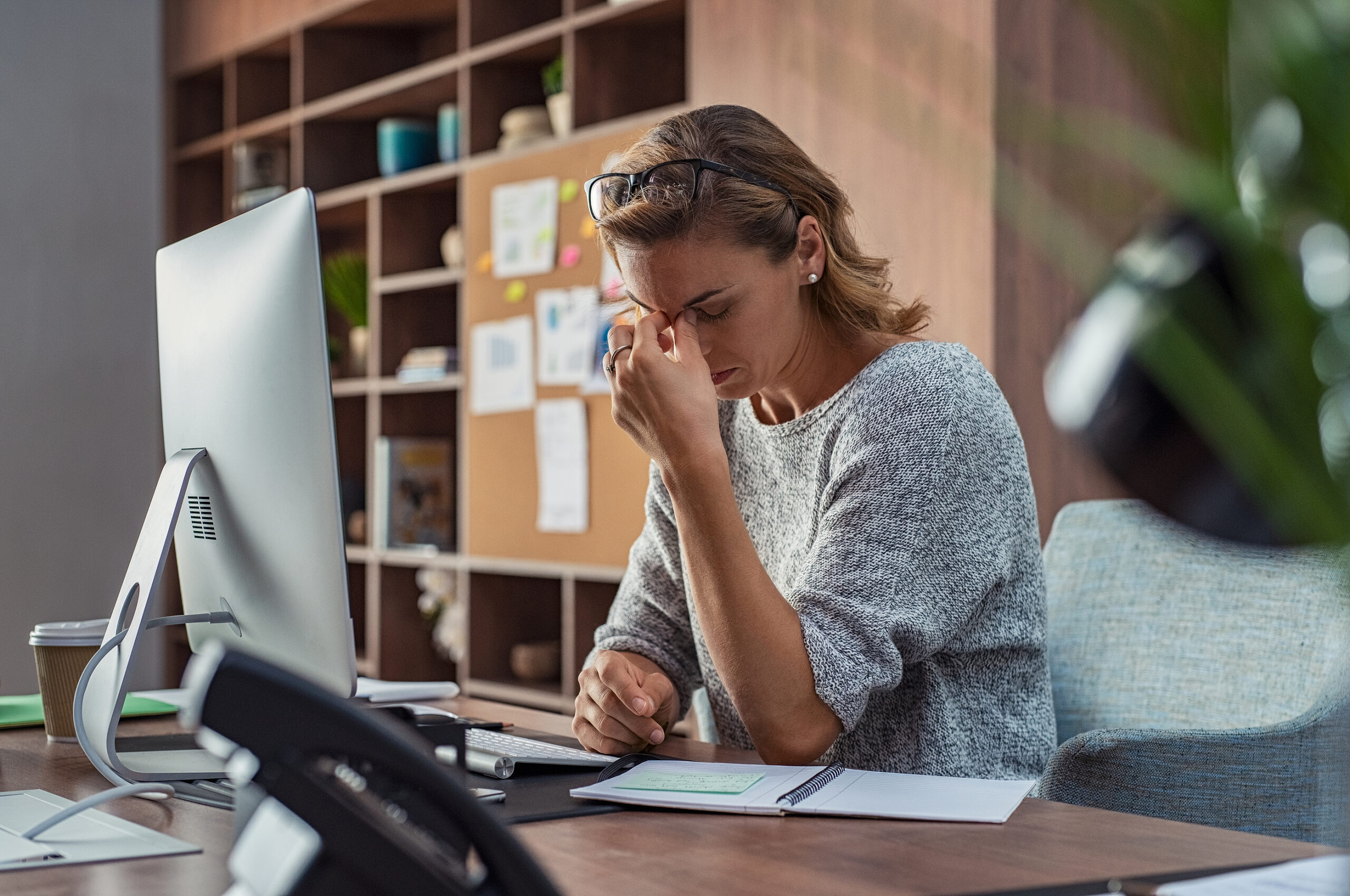 Exhausted leader at desk
